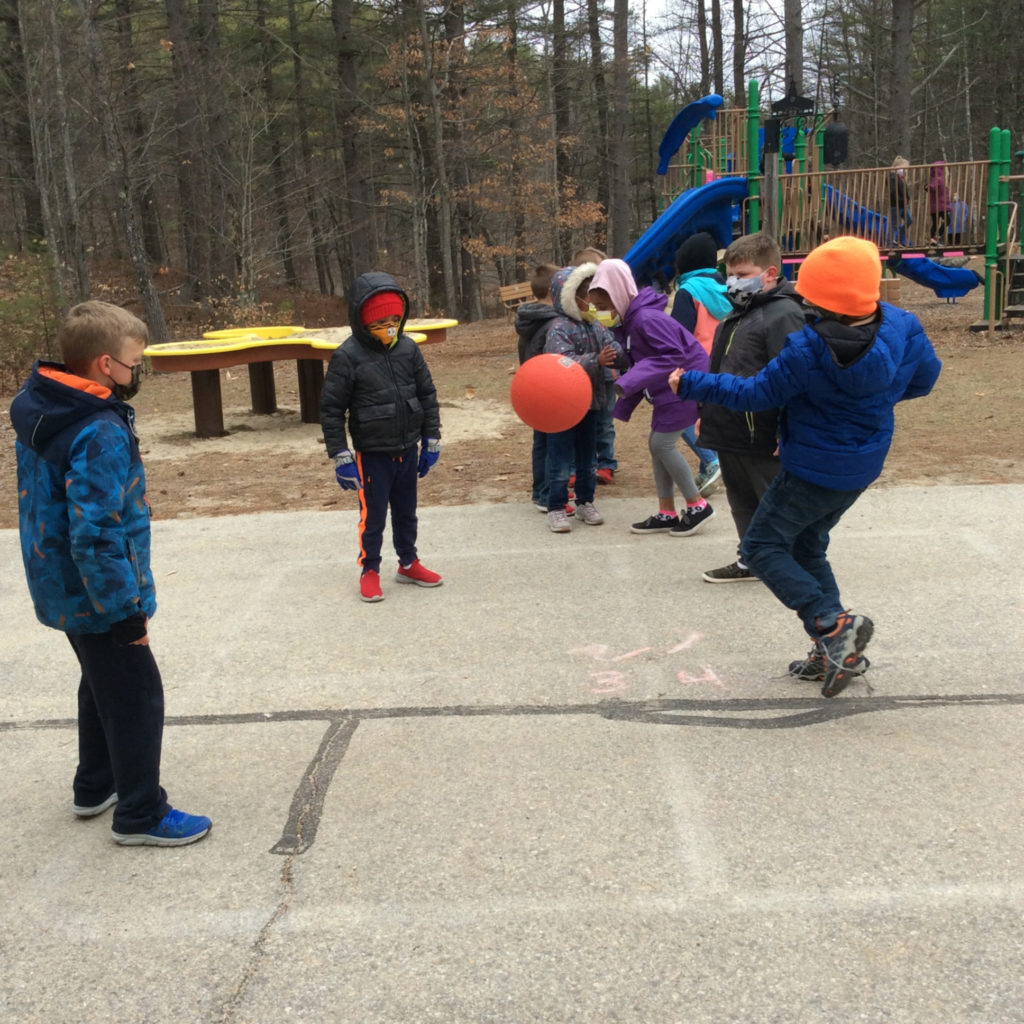 Featured image of article: Enjoying a game of 4-square at recess!