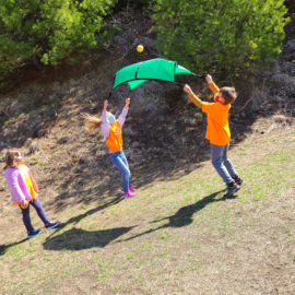 Featured image of article: Practicing Cooperation with a Parachute Toss!